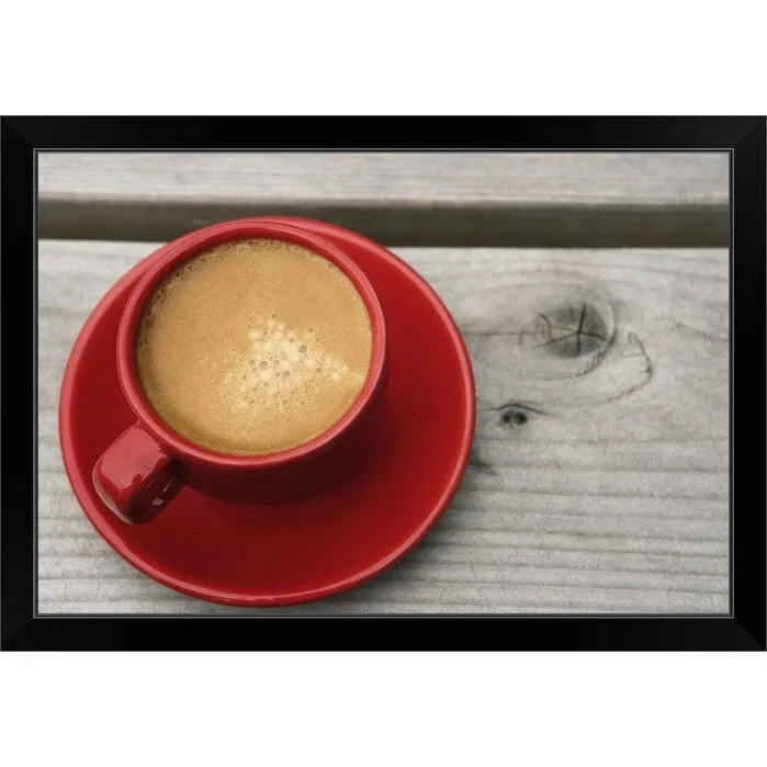 "A bright red cup of espresso coffee on a picnic table outdoors on a summer day." Black Framed Print